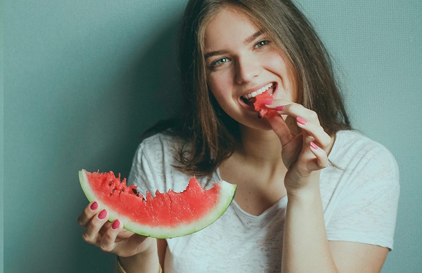 woman eats watermelon