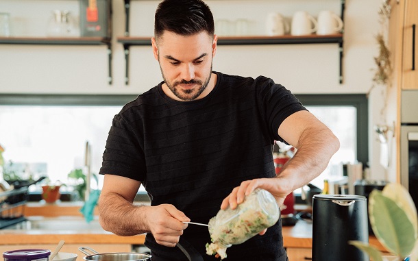 man prepares meal